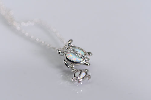 Sterling and opal double turtle pendant