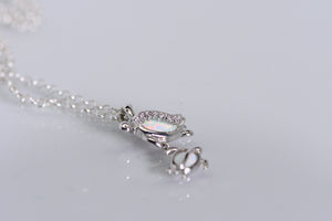 Sterling and opal double turtle pendant