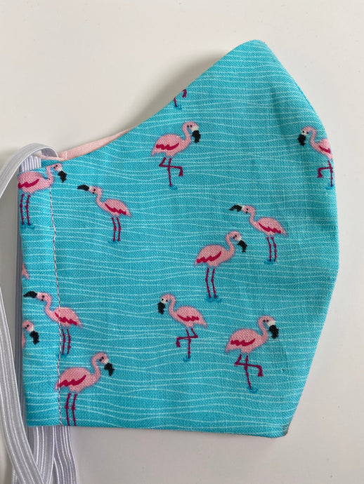 Pink Flamingos on turquoise face mask